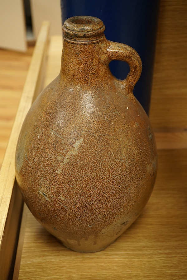 A lead glazed and manganese pewter-mounted ewer, a salt glazed pitcher and a terracotta pot, tallest 35cm